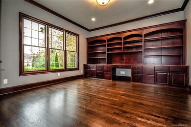 The main floor office with a wall of custom cabine