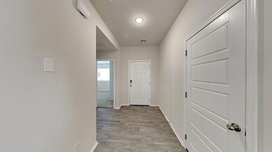 Hall featuring baseboards and light wood-style flooring