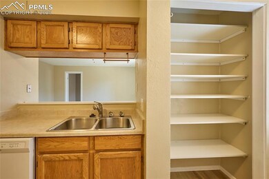 Kitchen pantry, sink and pass-through to dining ar