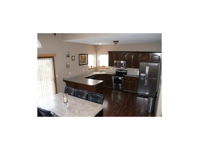 Kitchen with stainless appliances and dining area