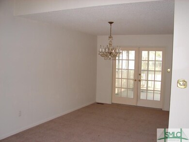 Dining area with French doors leading to screened 