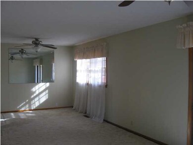 LOTS OF WINDOWS IN LIVING AND DINING.