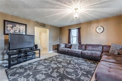 Living room space with updated lighting and modern
