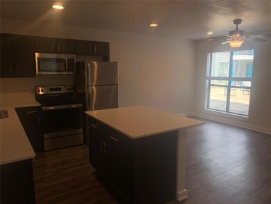Kitchen featuring dark hardwood / wood-style floor