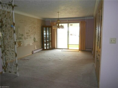 Dining room has glass sliders that lead to covered