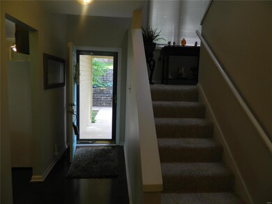 Front Door and Stair Case Going Upstairs.