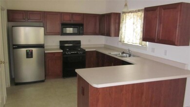 Kitchen with all appliances to stay.  