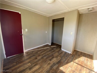Spare room featuring wood finished floors