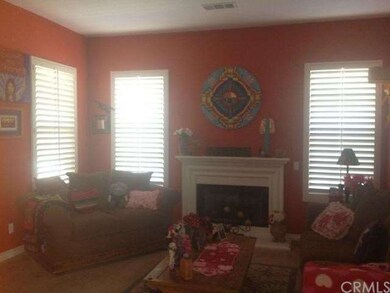 Formal Living Room has plantation shutter and carp