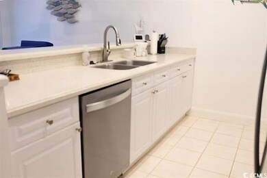 Kitchen with white cabinetry, sink, dishwasher, an