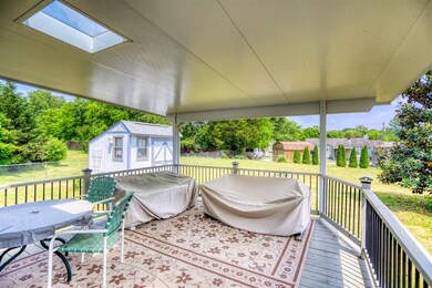 The homeowners added a insulated rood with skylights over their deck