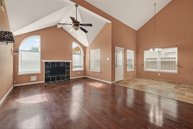 Living area featuring a fireplace with gas connections and convenient access to the backyard on the right.