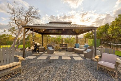 View of patio with a gazebo, an outdoor living sp