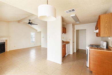 Kitchen with white appliances, open floor plan, u