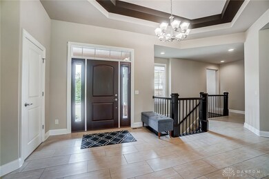 Large open foyer.  Notice the tray ceiling up abov