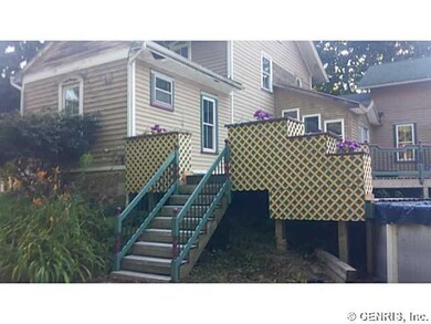Exterior Back. Stairs from side yard lead up to ex
