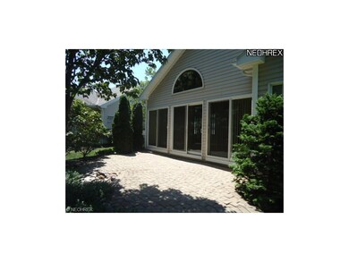 there is a paved patio that overlooks the private 