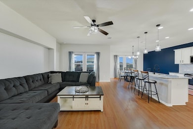 Living room featuring visible vents, baseboards, 