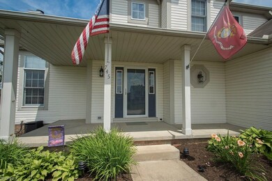 Relax on some rocking chairs on this covered front