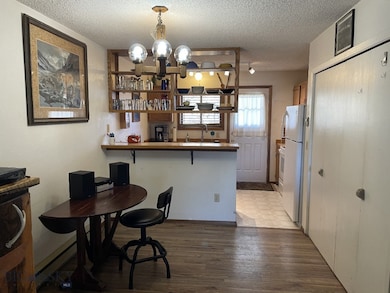 Dining room  open to kitchen with laminate floors,