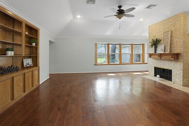 The family room has wood floors, new windows and a