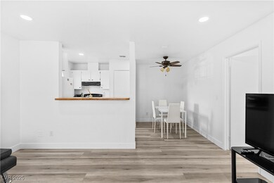 Living area featuring ceiling fan, recessed lighting, and baseboards