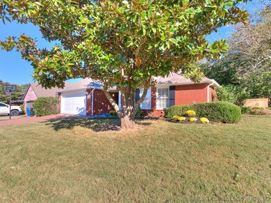 Large Magnolia tree out front, and large wooded HO