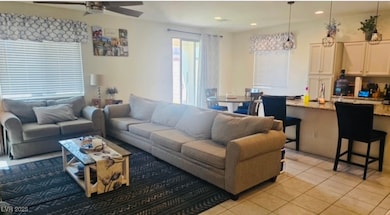 Living room featuring light tile patterned floorin