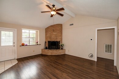 Spacious family room with a deep-set window and elevated ceiling.