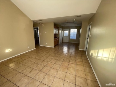 Unfurnished room with light tile patterned floors