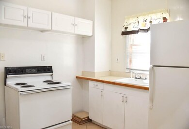 The kitchen comes applianced with an oven, range a