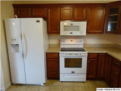 Refrigerator to remain with house!