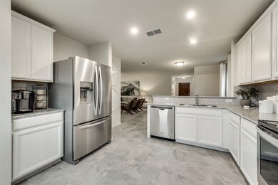 High-end gourmet kitchen with premium finishes and upgraded appliances *Model representation
