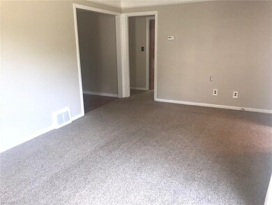 Living room leads to dining room & kitchen (left) 
