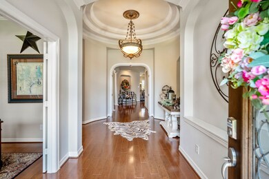 Elegance abounds the moment you enter this rare 1.5 story home. Featuring beautiful wood floors and custom arches framing several hallways.