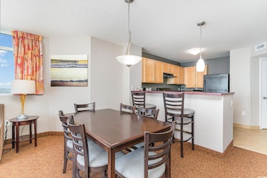 Dining space featuring light tile patterned floors