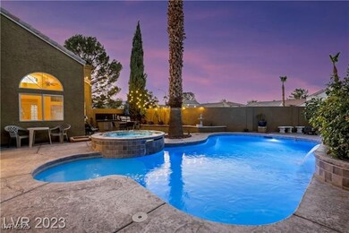 View of swimming pool featuring an in ground hot t