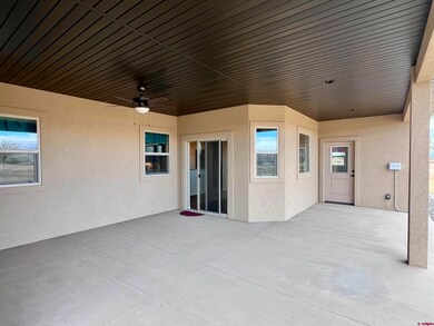 Covered back patio with access off dining room and