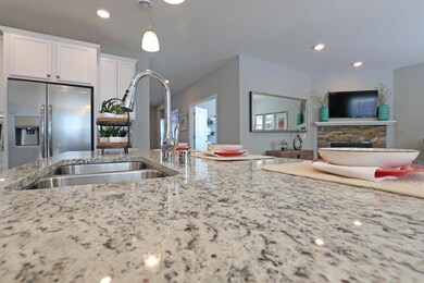 Granite countertops, stainless steel appliances ar