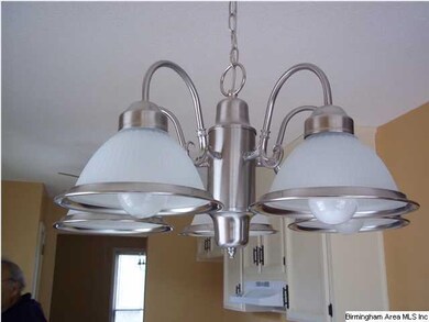 New light fixture in eat in kitchen area.