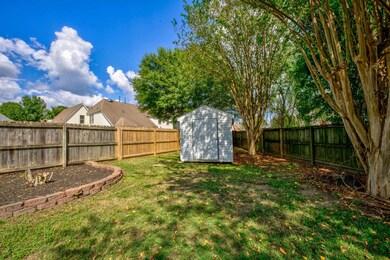 View of yard featuring a storage shed