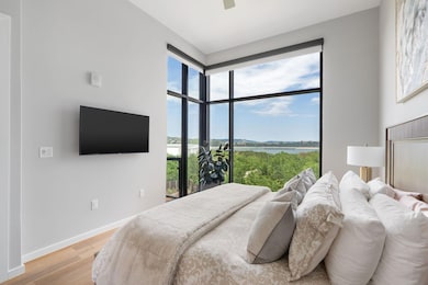 Bedroom with light wood-style flooring and ceiling fan