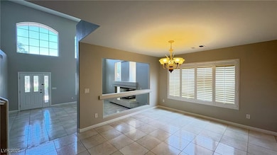Foyer with a chandelier, plenty of natural light,