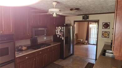 Kitchen featuring stainless steel appliances, a si