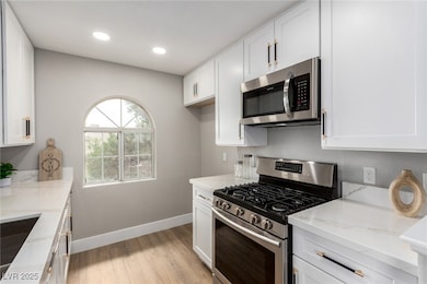 Kitchen featuring appliances with stainless steel