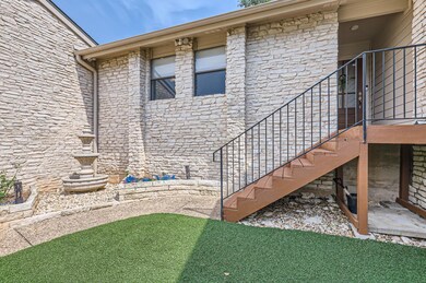 View of property exterior with stone siding