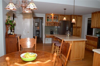 View from kitchen to front hallway/foyer.  Enter d