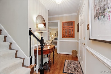 Entryway featuring wood finished floors, ornamenta