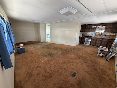 Unfurnished living room with carpet flooring