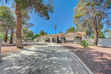 View of front of property with driveway, stucco si